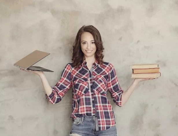 beautiful-young-woman-posing-with-books-laptop